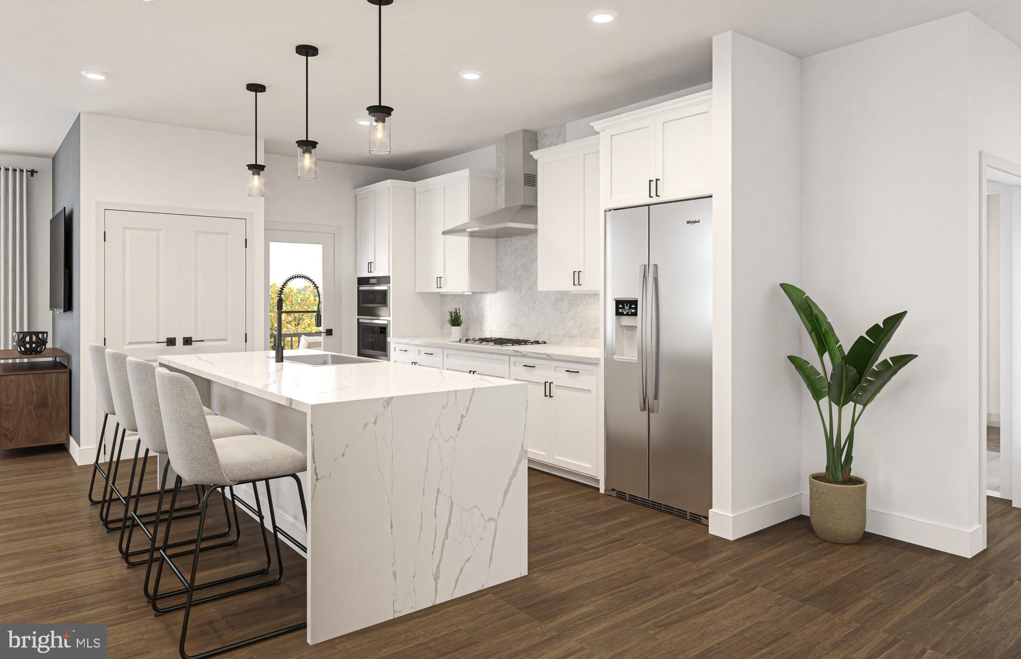 1121 Fortune Terrace, Unit 1 Potomac, MD 20854 - Photo 3 of 12 a kitchen with stainless steel appliances a dining table chairs refrigerator and microwave