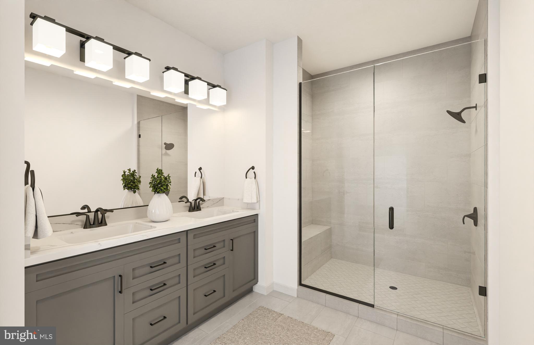 1121 Fortune Terrace, Unit 1 Potomac, MD 20854 - Photo 6 of 12 a bathroom with a double vanity sink mirror and shower