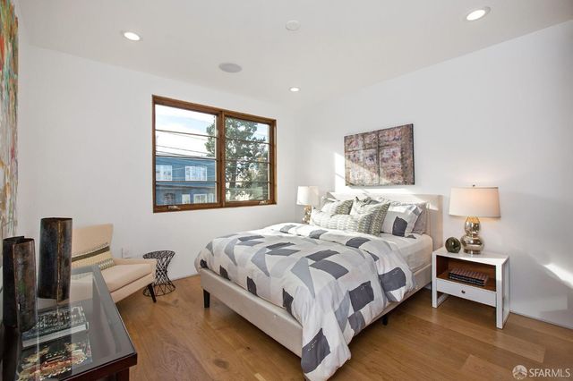 a bedroom with bed and a window