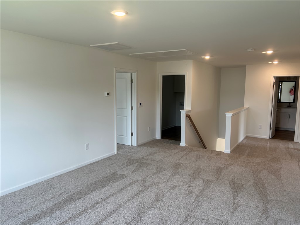 217 Bellflower Lane Anderson, SC 29625 - Photo 20 of 27 A versatile loft area features soft carpeting and recessed lighting, ready for your personalized touch.