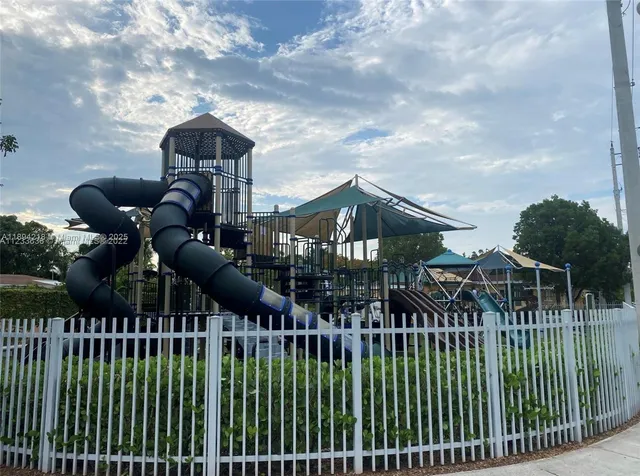 a view of a house with iron fence