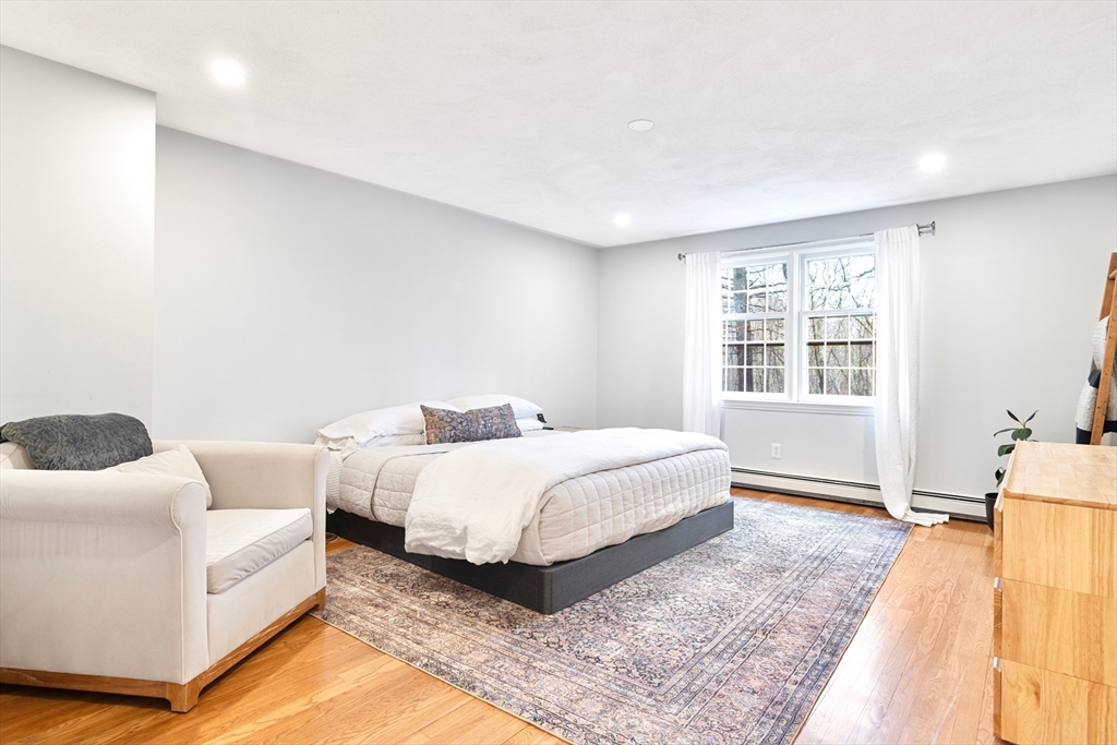 21 Batchelder Road Boxford, MA 01921 - Photo 18 of 37 a spacious bedroom with a bed and a couch