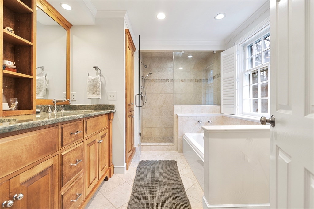21 Batchelder Road Boxford, MA 01921 - Photo 20 of 37 a bathroom with a granite countertop sink a large mirror and a shower