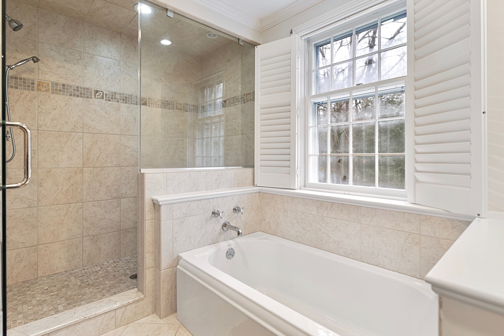 21 Batchelder Road Boxford, MA 01921 - Photo 21 of 37 a bathroom with a bathtub and window