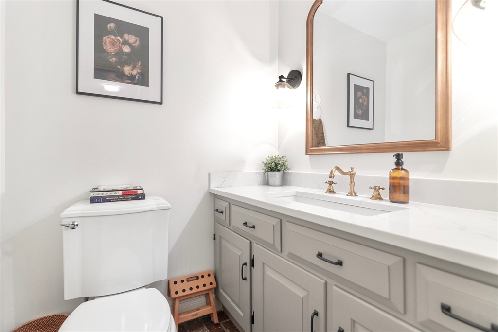 21 Batchelder Road Boxford, MA 01921 - Photo 23 of 37 a bathroom with a toilet sink and mirror