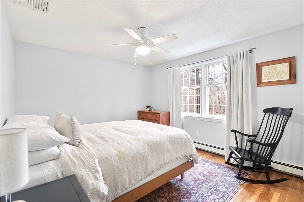 21 Batchelder Road Boxford, MA 01921 - Photo 24 of 37 a bedroom with a bed chair and two windows