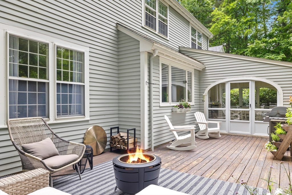 21 Batchelder Road Boxford, MA 01921 - Photo 29 of 37 a view of house with chairs and floor to ceiling window