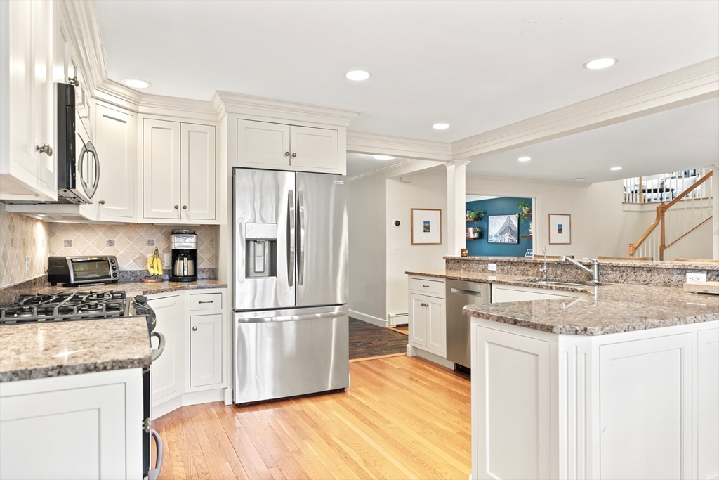 21 Batchelder Road Boxford, MA 01921 - Photo 5 of 37 a kitchen with kitchen island granite countertop appliances cabinets and a counter space