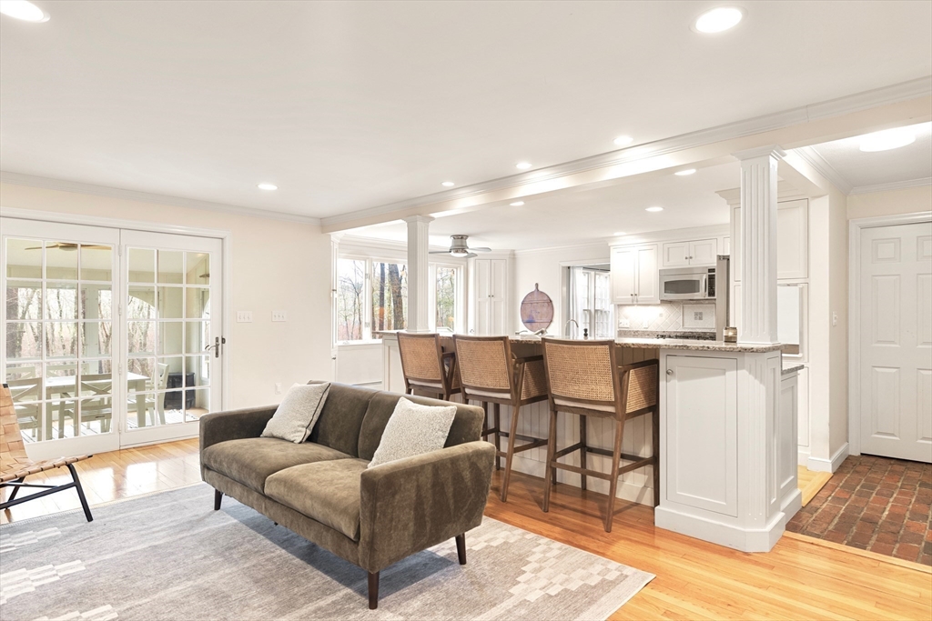 21 Batchelder Road Boxford, MA 01921 - Photo 8 of 37 a living room with furniture and a large window with kitchen view