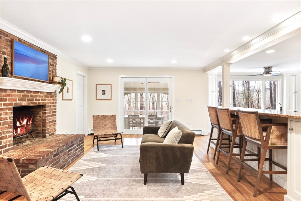 21 Batchelder Road Boxford, MA 01921 - Photo 9 of 37 a living room with furniture a fireplace and a table