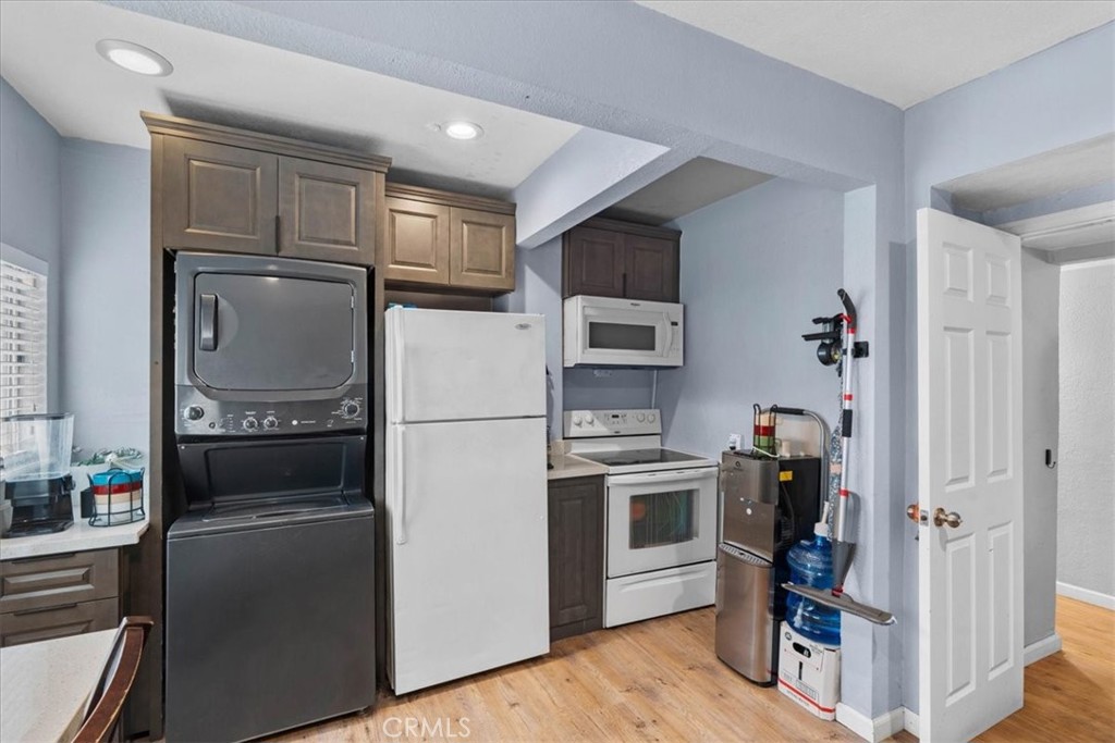 3974 5th Street Riverside, CA 92501 - Photo 18 of 45 a kitchen with stainless steel appliances a refrigerator stove and microwave