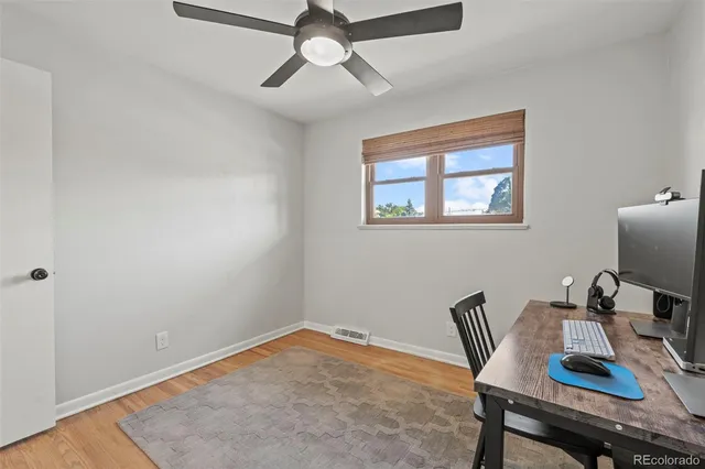 a workspace with furniture and window