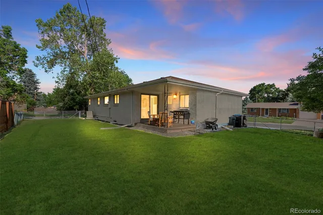 a front view of a house with a garden and porch