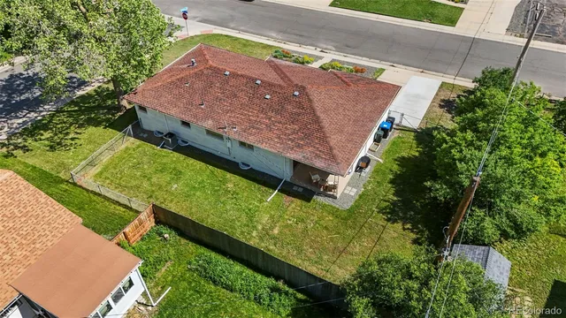 an aerial view of a house with a yard