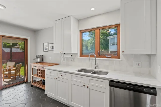 a kitchen with a sink stove and cabinets