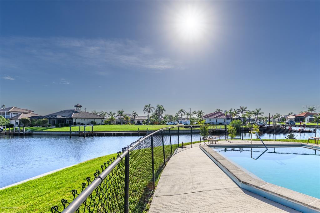 1204 Spanish Cay Lane, Unit B Punta Gorda, FL 33950 - Photo 1 of 45 a view of swimming pool and outdoor seating