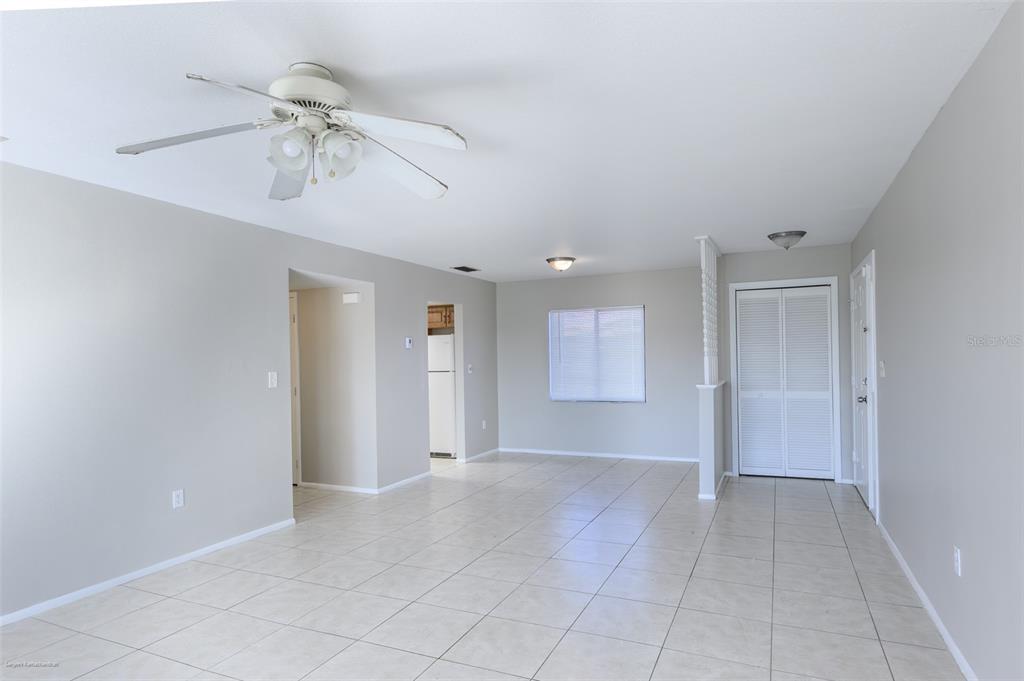 1204 Spanish Cay Lane, Unit B Punta Gorda, FL 33950 - Photo 14 of 45 a view of an empty room and chandelier fan
