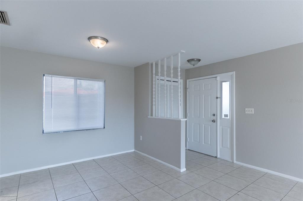 1204 Spanish Cay Lane, Unit B Punta Gorda, FL 33950 - Photo 16 of 45 a view of an empty room with window and closet area