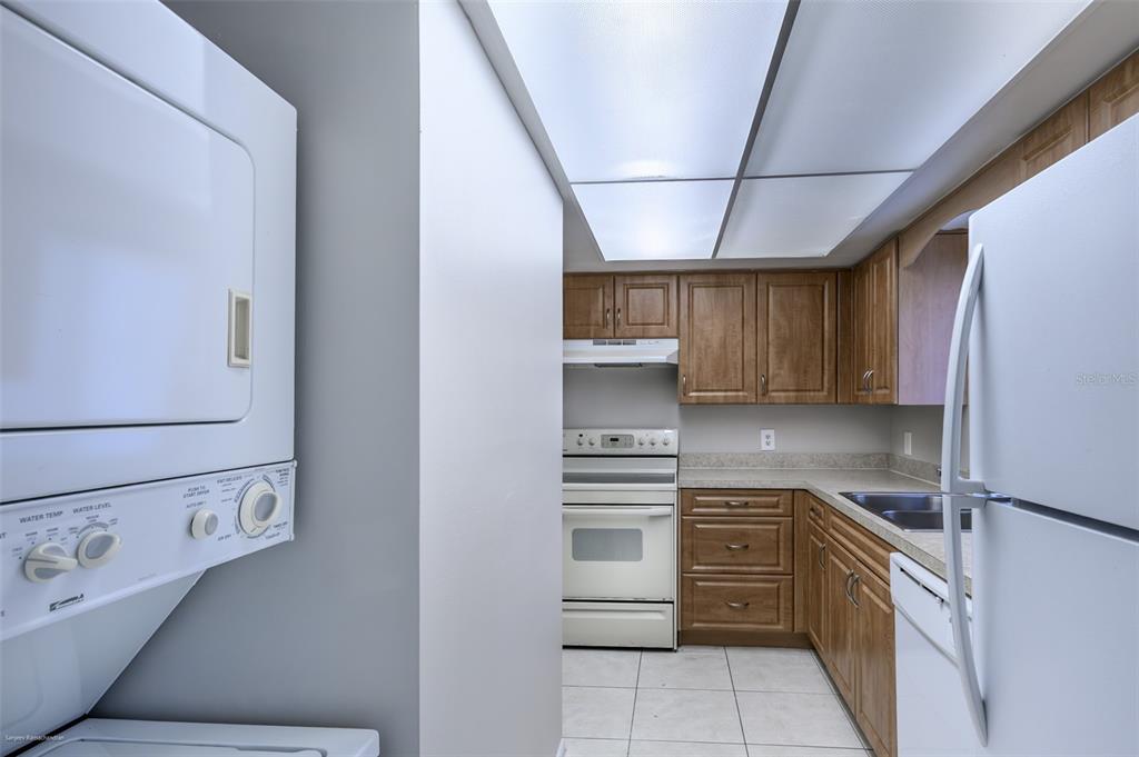 1204 Spanish Cay Lane, Unit B Punta Gorda, FL 33950 - Photo 19 of 45 a kitchen with a refrigerator stove and sink