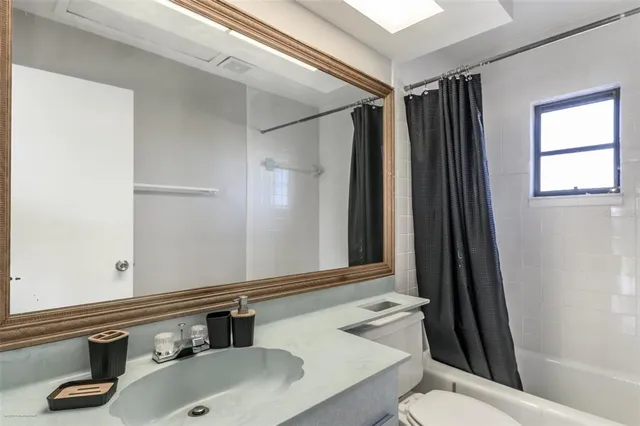 a bathroom with a shower and a tub