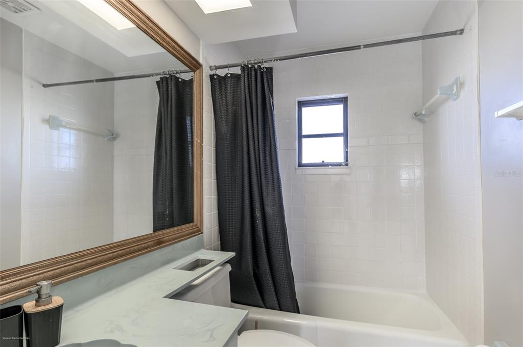 1204 Spanish Cay Lane, Unit B Punta Gorda, FL 33950 - Photo 28 of 45 a bathroom with a shower and a tub