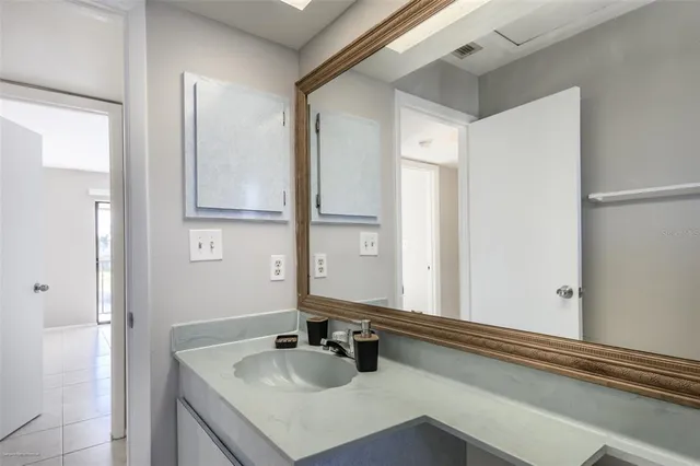 a view of a livingroom with a ceiling fan and window