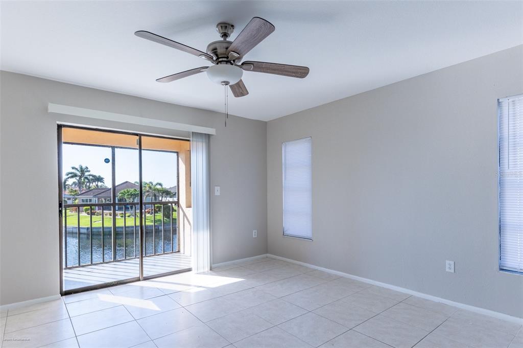 1204 Spanish Cay Lane, Unit B Punta Gorda, FL 33950 - Photo 30 of 45 a view of a livingroom with a ceiling fan and window