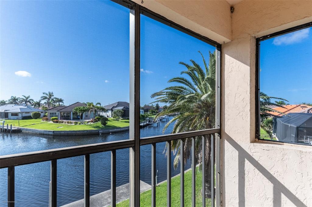 1204 Spanish Cay Lane, Unit B Punta Gorda, FL 33950 - Photo 3 of 45 a view of a balcony with outdoor space
