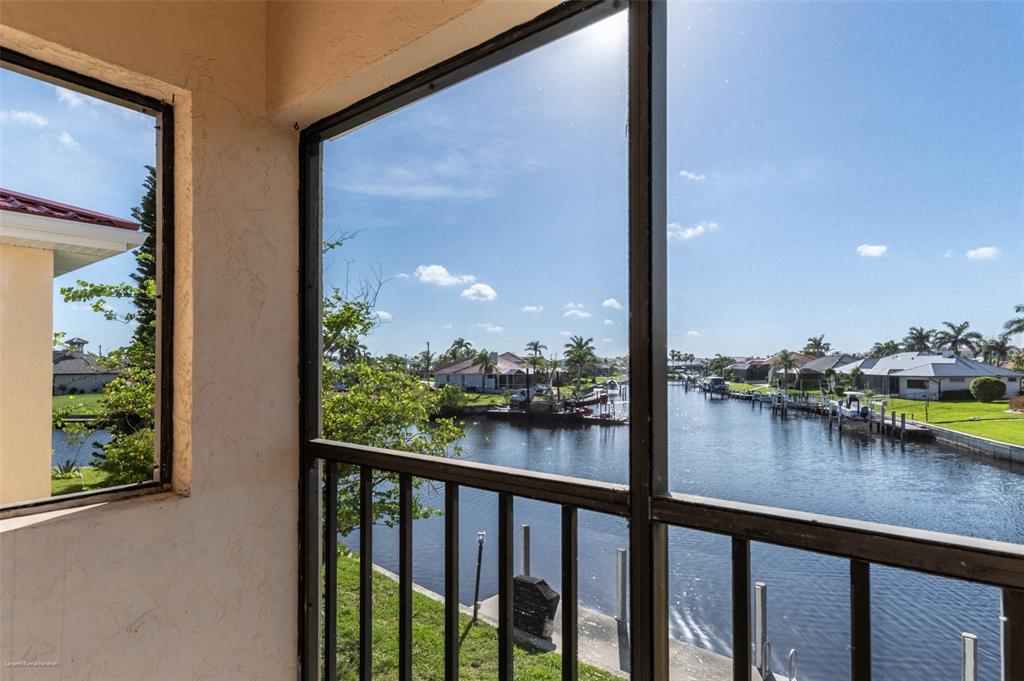 1204 Spanish Cay Lane, Unit B Punta Gorda, FL 33950 - Photo 34 of 45 a view of a lake from a balcony