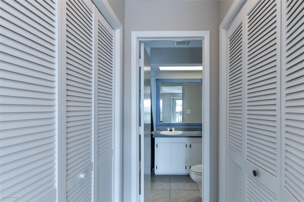 1204 Spanish Cay Lane, Unit B Punta Gorda, FL 33950 - Photo 37 of 45 a view of a hallway with a white cabinet and a bathroom