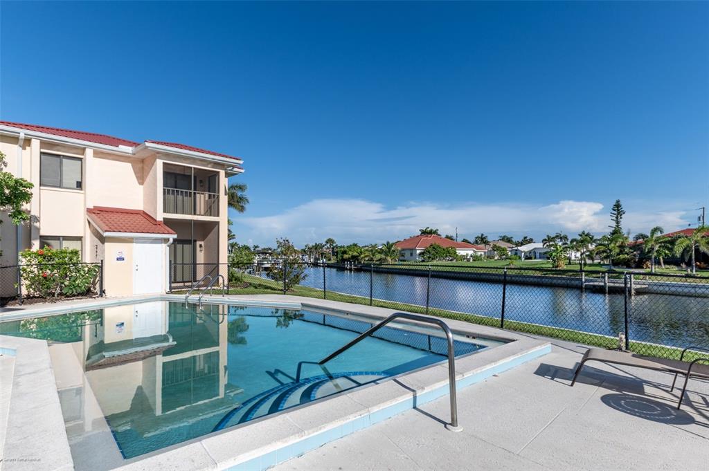 1204 Spanish Cay Lane, Unit B Punta Gorda, FL 33950 - Photo 4 of 45 a view of a terrace with chairs