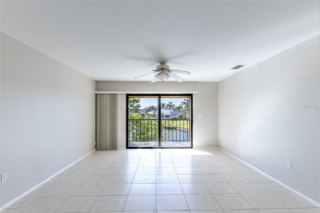 1204 Spanish Cay Lane, Unit B Punta Gorda, FL 33950 - Photo 6 of 45 a view of an empty room with a window