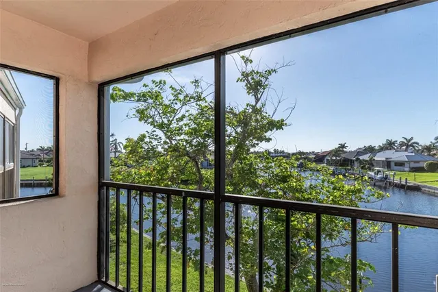 a view of a balcony with wooden floor and outdoor space