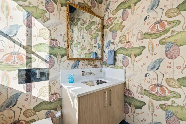 a bedroom with two beds and a window