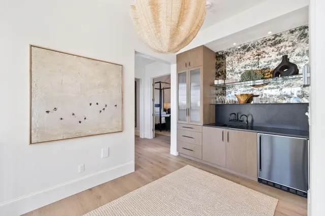 a kitchen with a sink and a refrigerator
