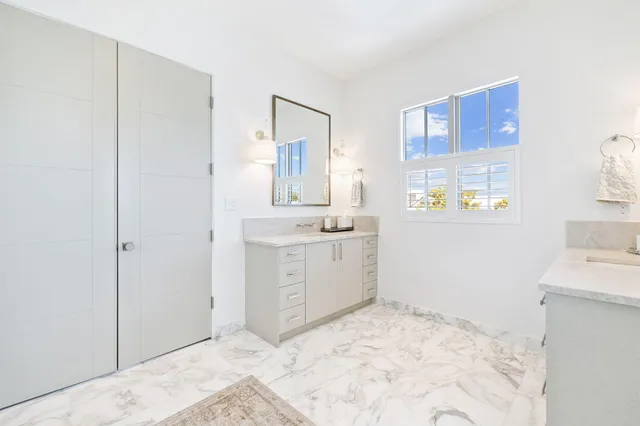 an aerial view of residential houses with wooden floor and city view