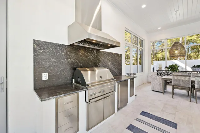 a view of a swimming pool with outdoor seating