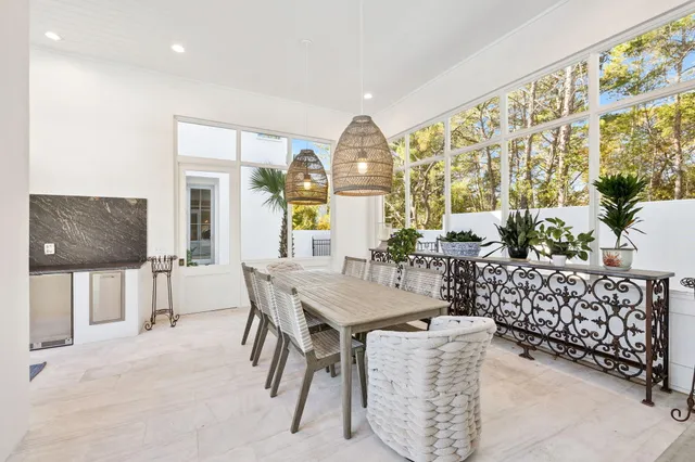 a view of a swimming pool with an outdoor seating