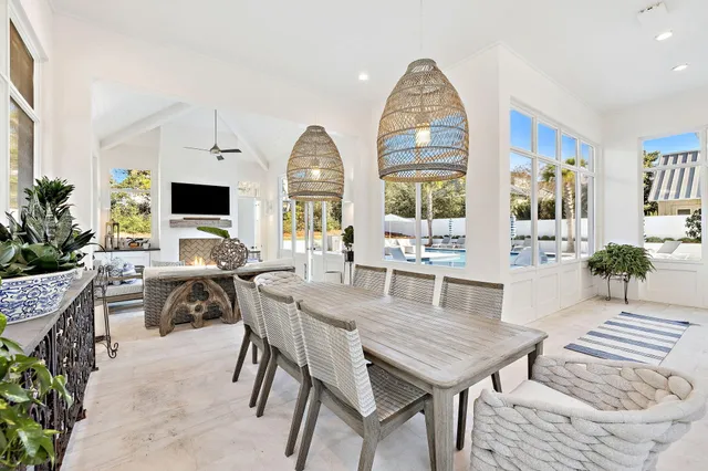a view of a house with swimming pool and sitting area