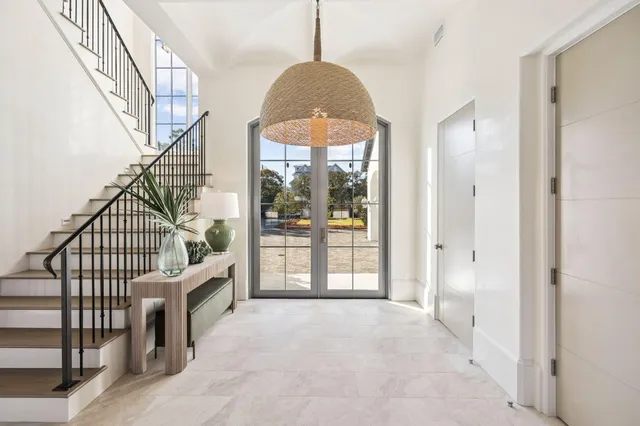 a view of a dining room with furniture and a large window