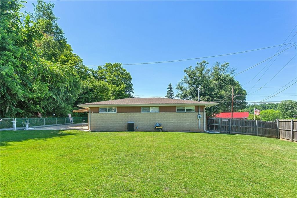 101 Janet Street Perryopolis, PA 15473 - Photo 20 of 22 a view of a house with a backyard