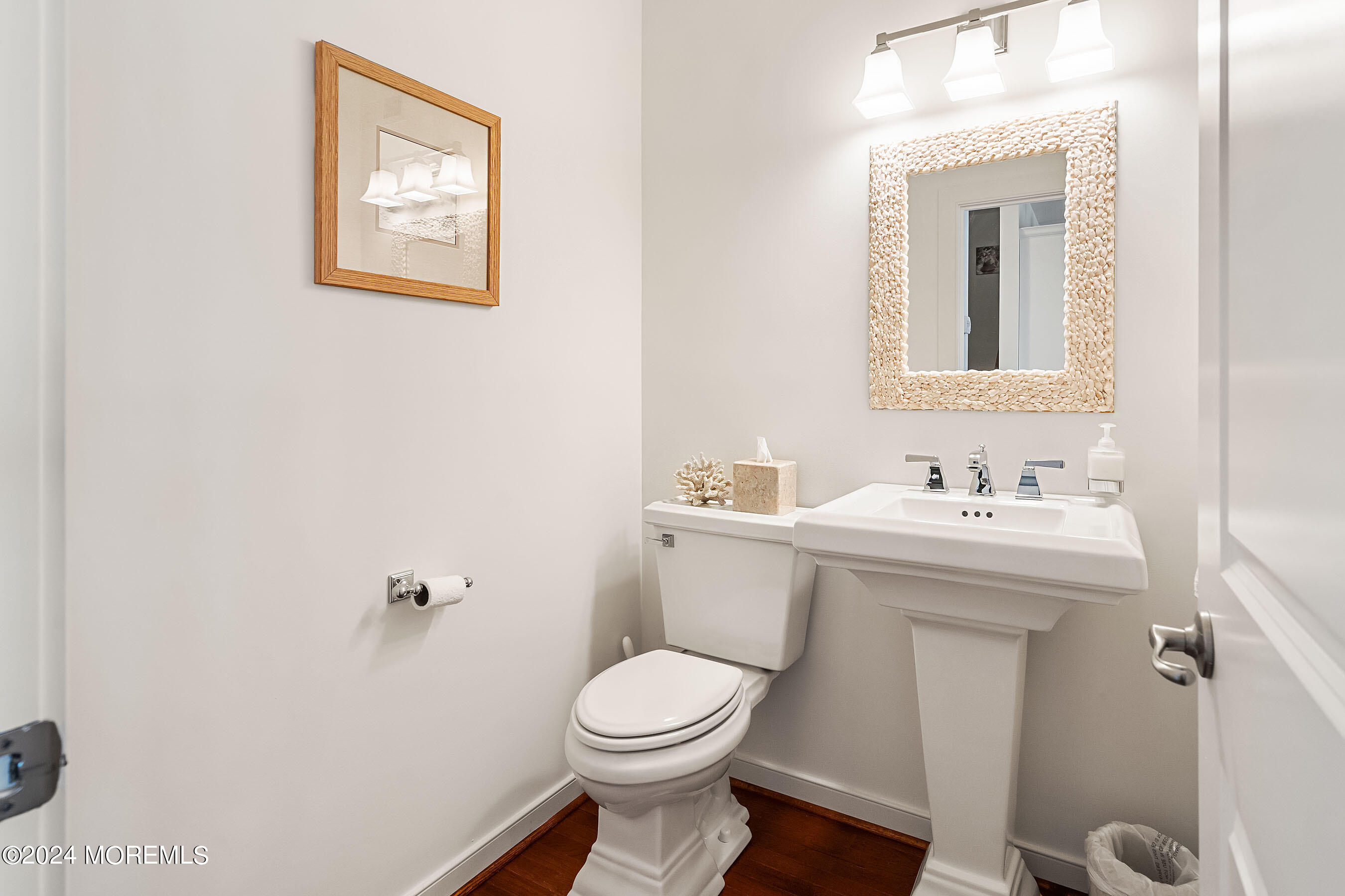 556 Riverside Drive Manasquan, NJ 08736 - Photo 15 of 42 a bathroom with a sink mirror and toilet