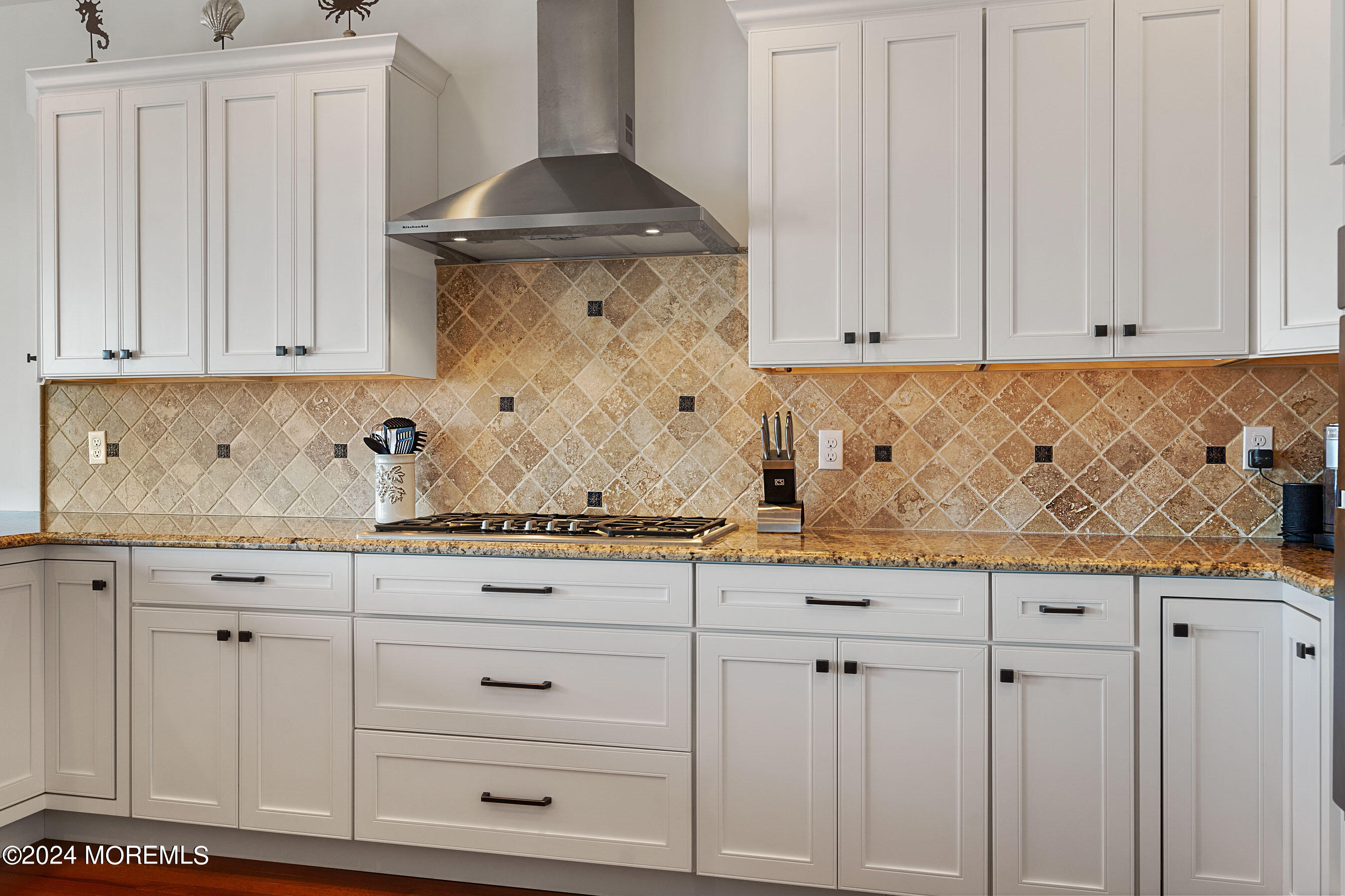 556 Riverside Drive Manasquan, NJ 08736 - Photo 20 of 42 a kitchen with granite countertop white cabinets and sink