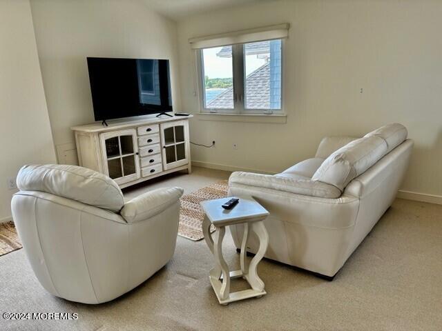 556 Riverside Drive Manasquan, NJ 08736 - Photo 30 of 42 a living room with furniture and a flat screen tv