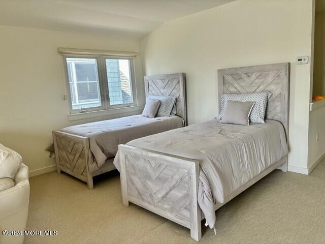 556 Riverside Drive Manasquan, NJ 08736 - Photo 31 of 42 a bedroom with a bed and window