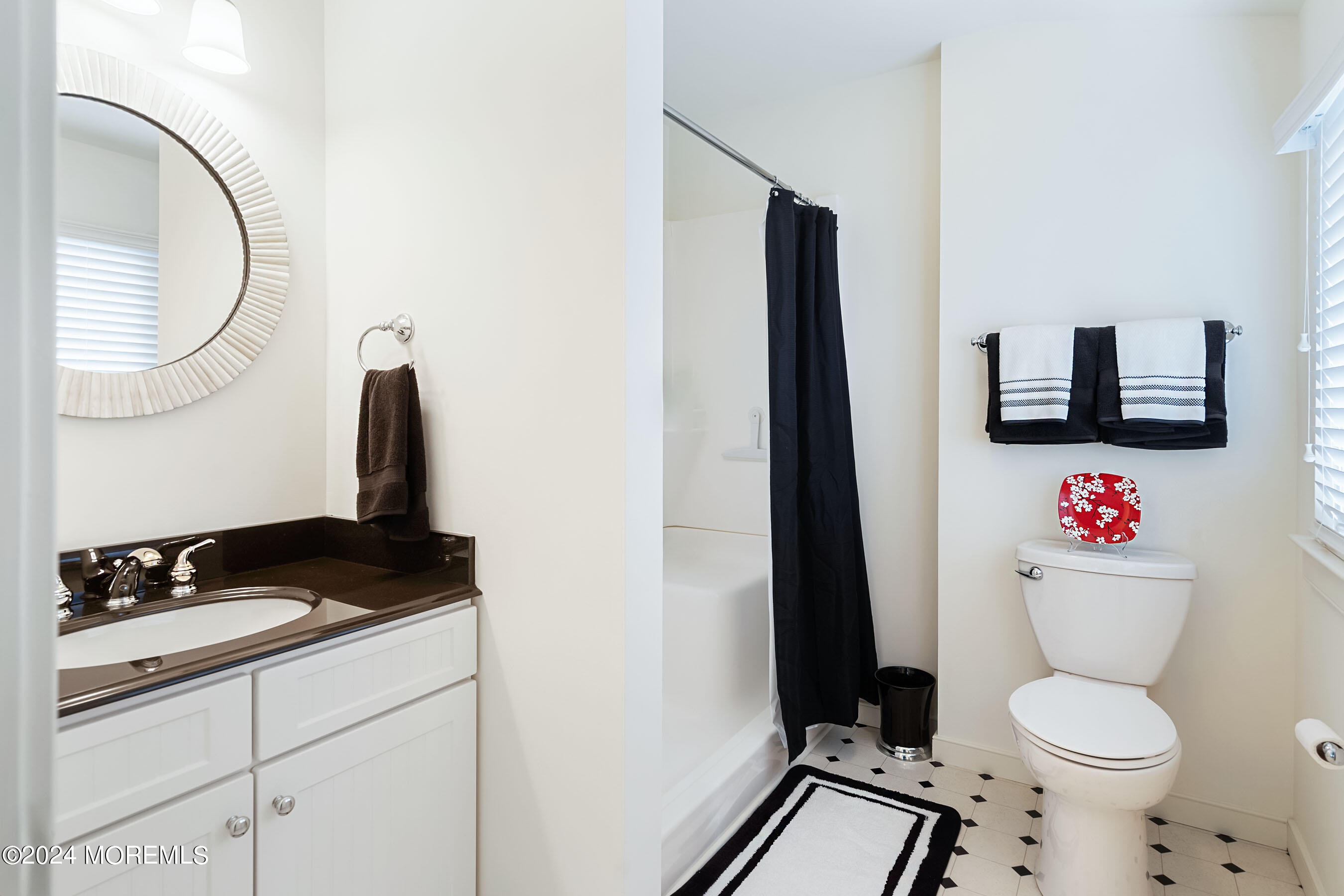 556 Riverside Drive Manasquan, NJ 08736 - Photo 35 of 42 a bathroom with a toilet a sink and a mirror