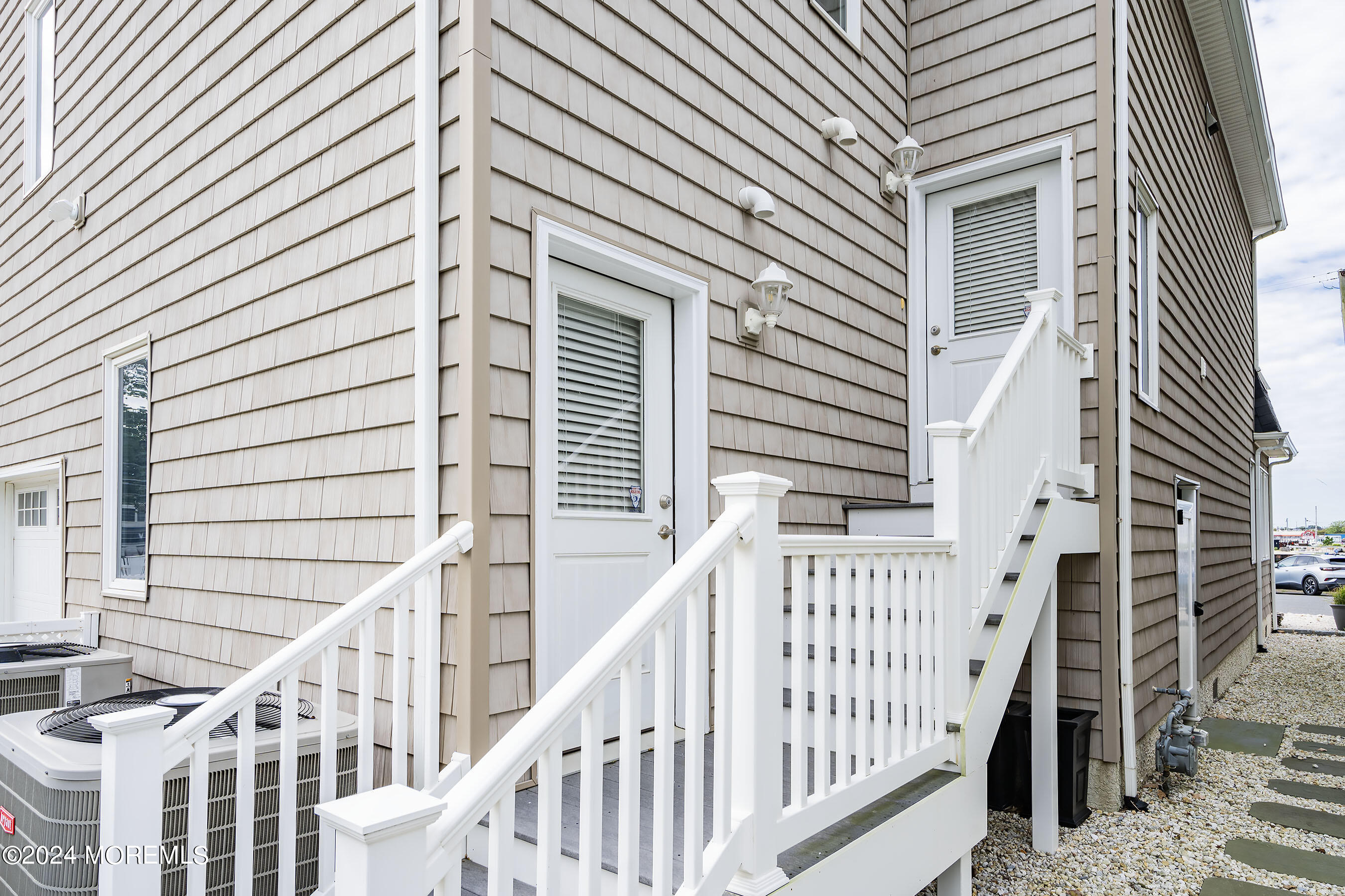 556 Riverside Drive Manasquan, NJ 08736 - Photo 36 of 42 a view of a house with wooden stairs