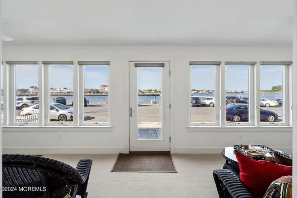 a living room with furniture and windows