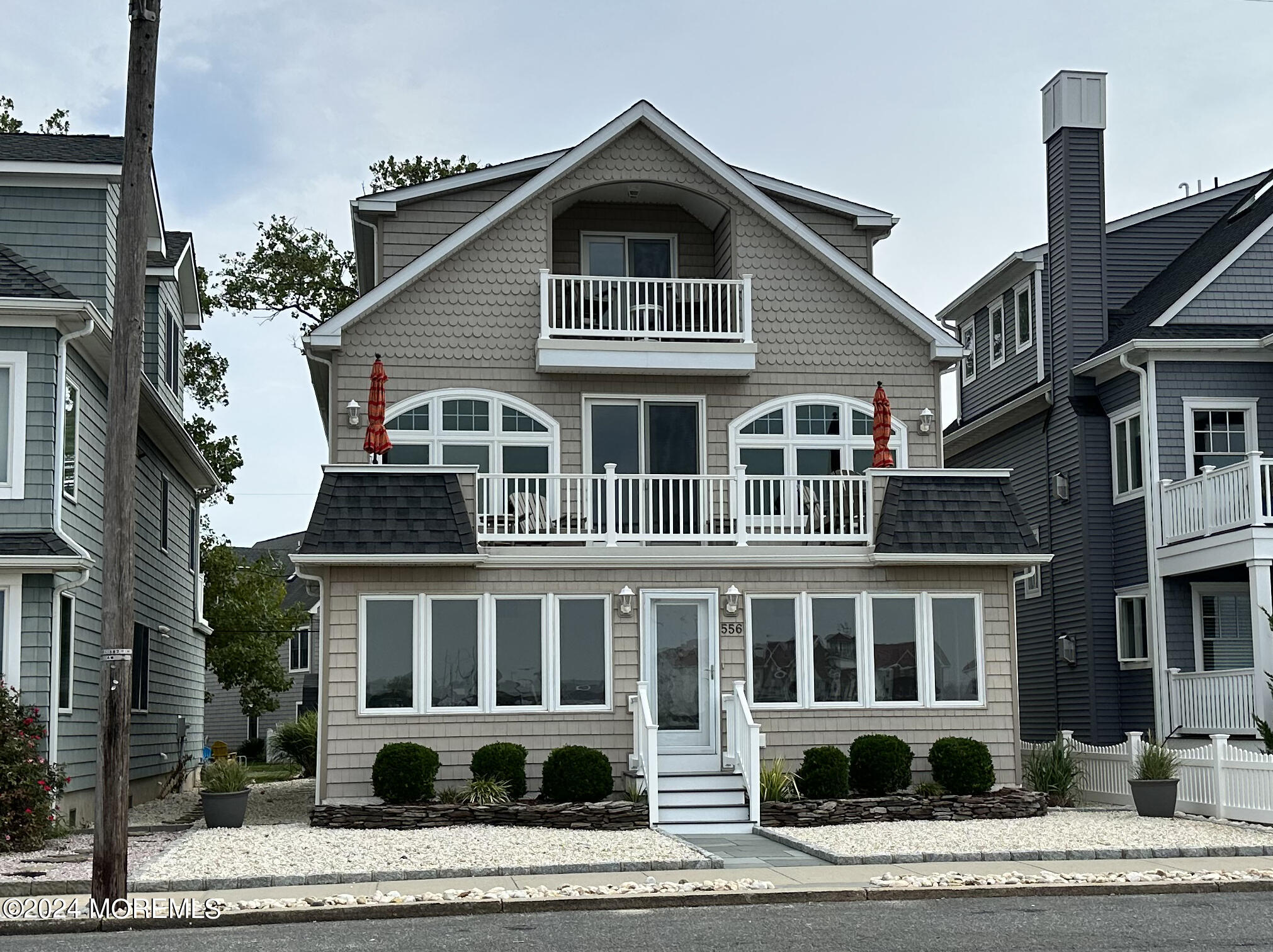 556 Riverside Drive Manasquan, NJ 08736 - Photo 42 of 42 a front view of a house with a yard