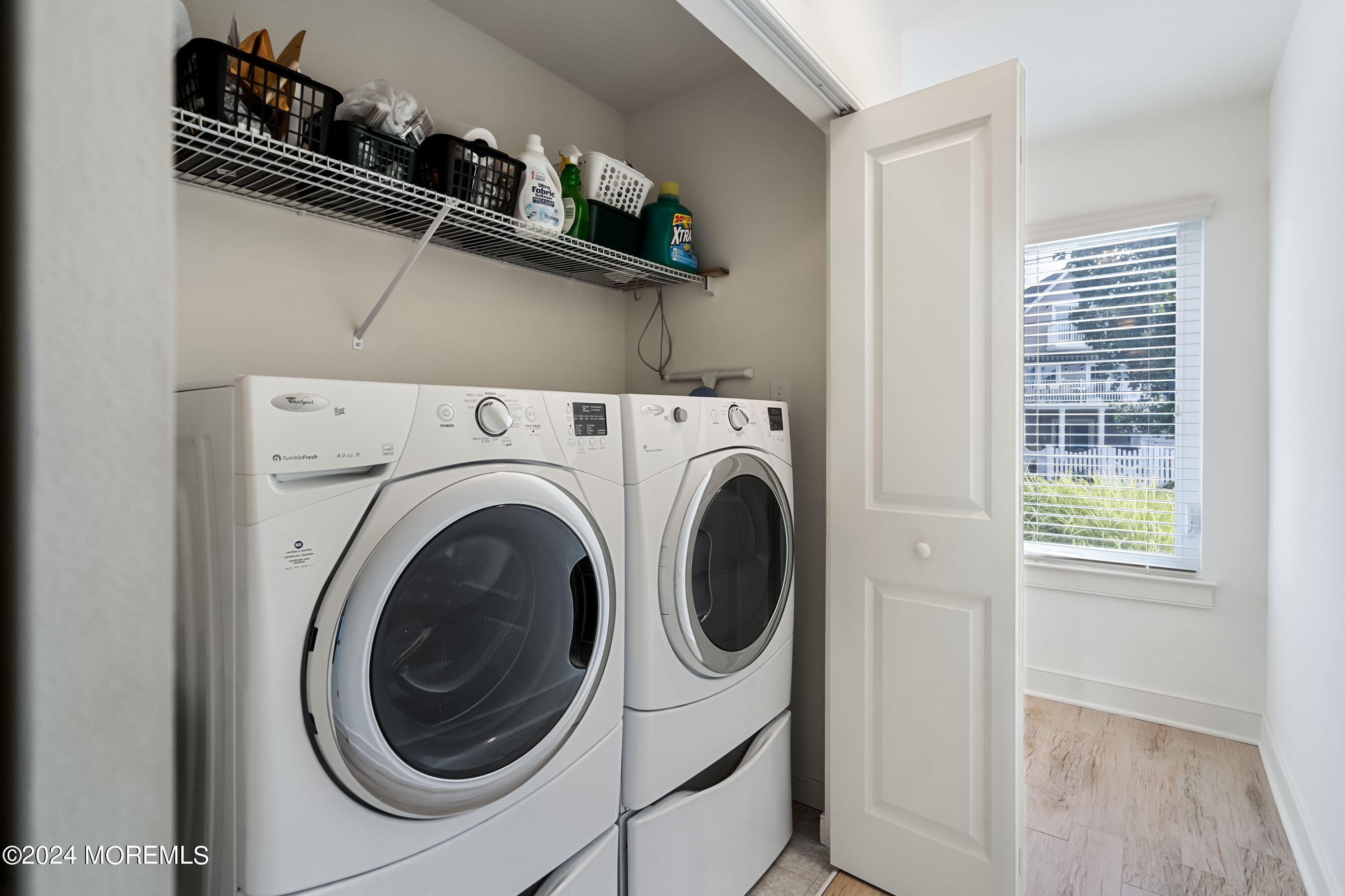 556 Riverside Drive Manasquan, NJ 08736 - Photo 5 of 42 a utility room with dryer and washer